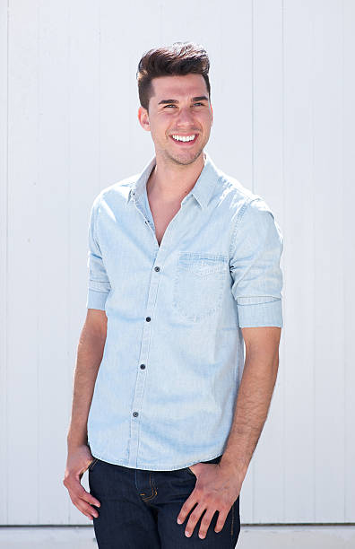 istock Good looking young man smiling outdoors against white background 176595117
