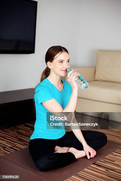 Young Woman Drinking Water After Joga Exercises Stock Photo - Download Image Now - Activity, Adult, Adults Only