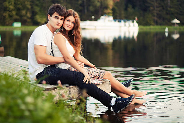 Young couple on the river stock photo