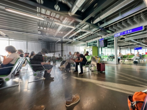 geneva, switzerland - June 28 2023: passengers walking in an airport terminal before getting a flight