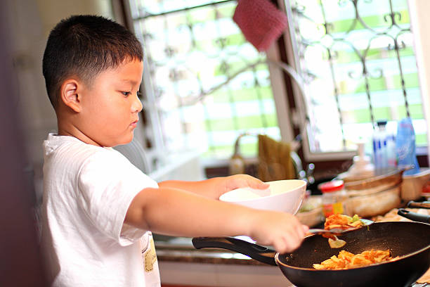 istock The little Boys are cooking 176596262