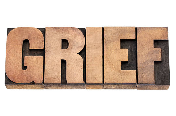istock grief word in wood type 176596845