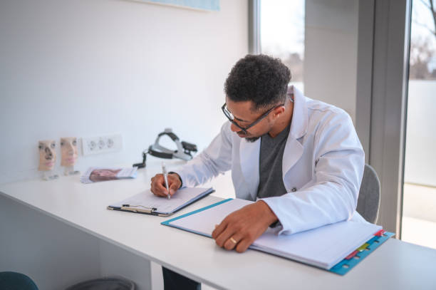 istock African American Doctor Writing A Medical Chart 1765977351