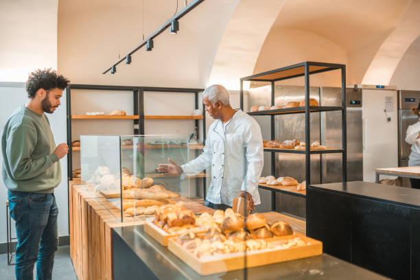 istock Middle Eastern Male Buying Bread In A Small Artisan Bakery 1765977822