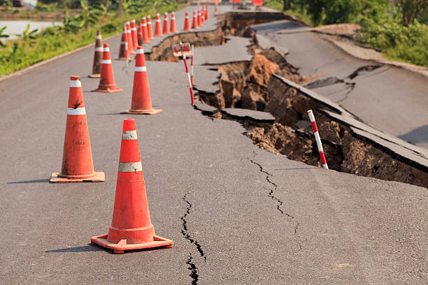 istock Traffic cones on the cracked asphalt road 176598522