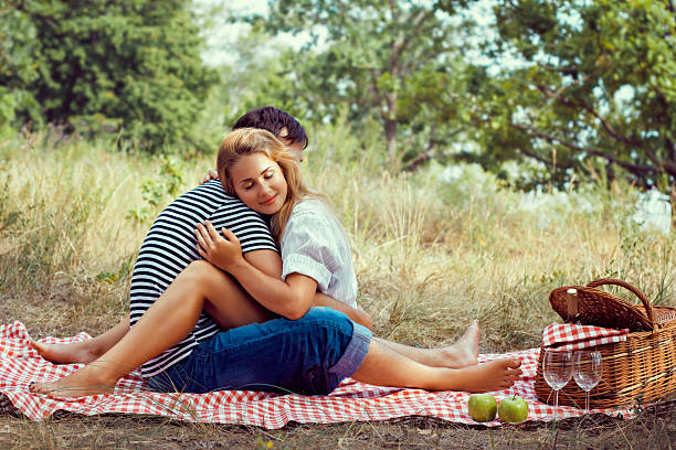istock couple on picnic, sitting closed eyes 176599730