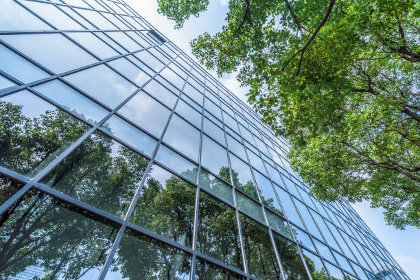 istock modern office building with green leaves 1766005840