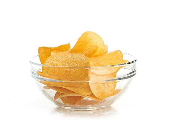 istock Delicious potato chips in bowl isolated on white 176600822