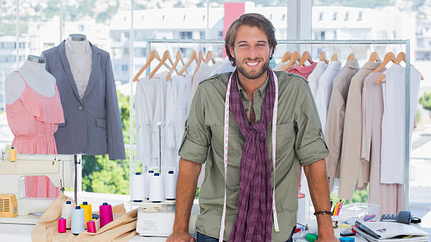 istock Fashion designer leaning on his desk 176601254