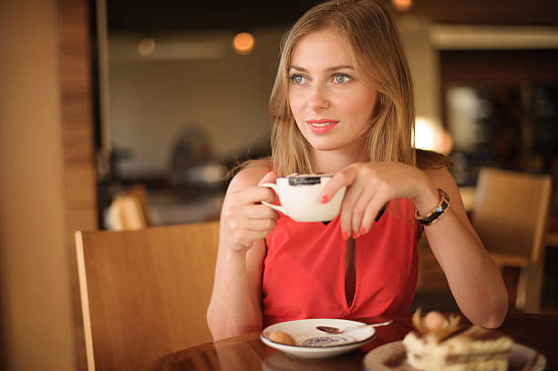 istock Pretty Young Woman in Cafe 176602548
