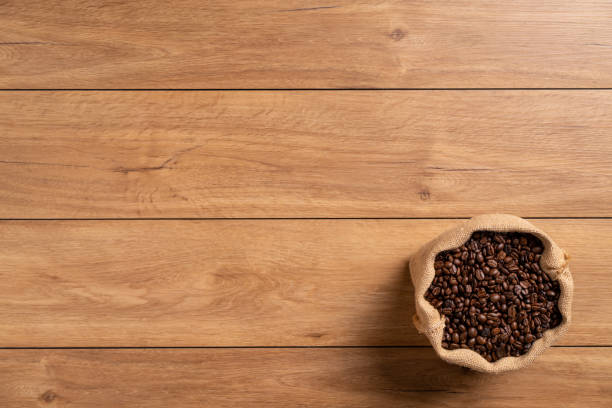 istock The many coffee beans on a wooden table 1766042415