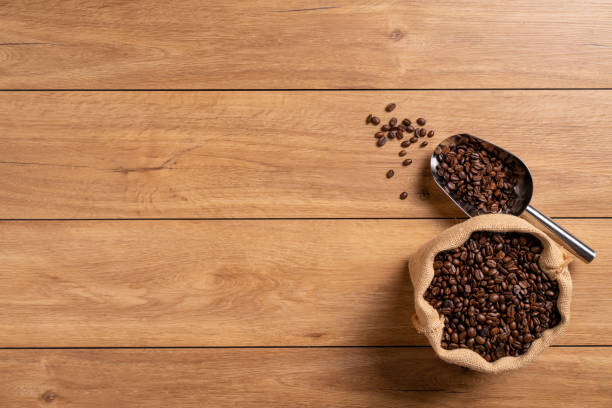 istock The many coffee beans on a wooden table 1766042440