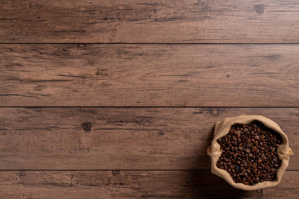 istock The many coffee beans on a wooden table 1766043267