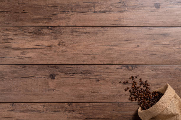 istock The many coffee beans on a wooden table 1766043537