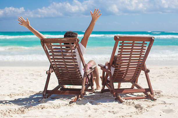 istock young father with daughter in beach chairs 176607227
