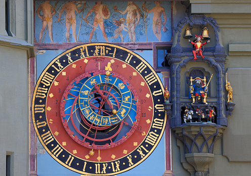 Bern, Switzerland - July 9, 2023 : Astronomical clock on the medieval Zytglogge clock tower in Kramgasse street in old city center of Bern, Switzerland
