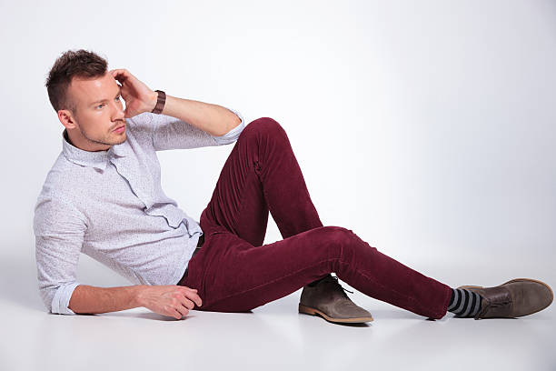 istock casual man on the floor looks away 176609145