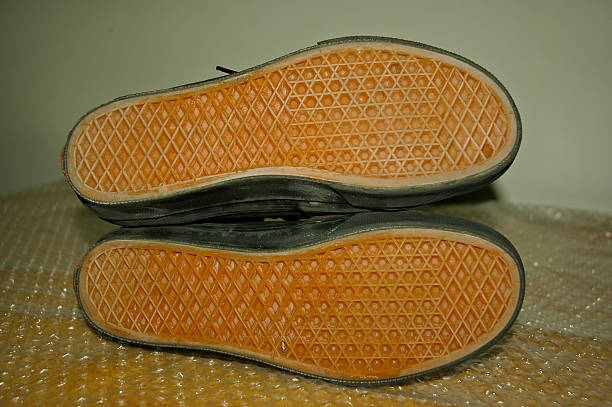 istock old orange sole black shoes 176609844