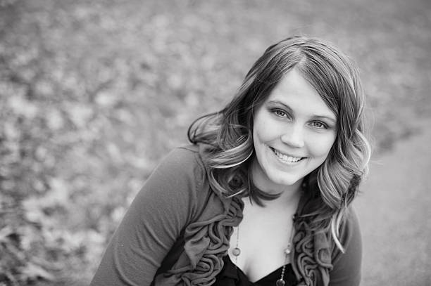 istock College Age Girl Sitting Outside in the Fall 176609873