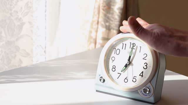 Alarm clock by the window that sounds an alarm sound