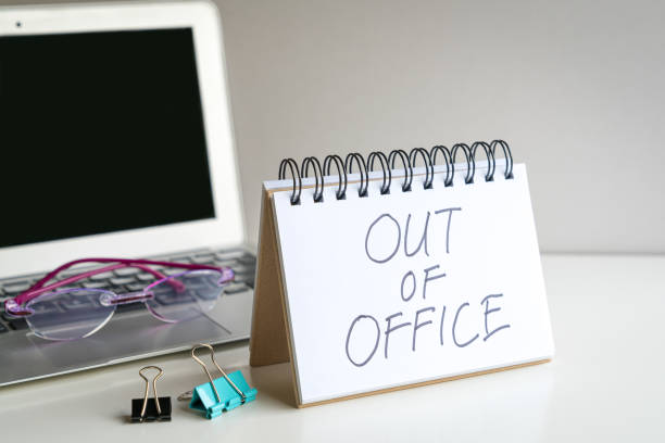 istock Out of office, message next to computer laptop. 1766111860