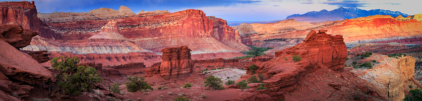 Panoramic View Overlooking Sulfur Creek and the Waterpocket Fold from Sunset Point in Capitol Reef National Park with the Henry mountains in the background in Utah USA.
