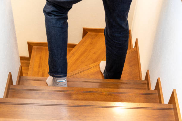 istock A person going down the wooden stairs 1766116705