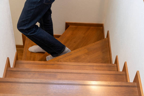 istock A person going down the wooden stairs 1766116711