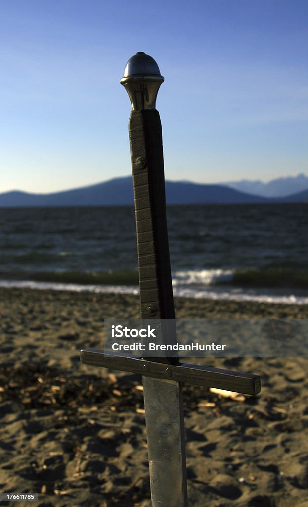 Claim the Land A sword near the ocean Abandoned Stock Photo