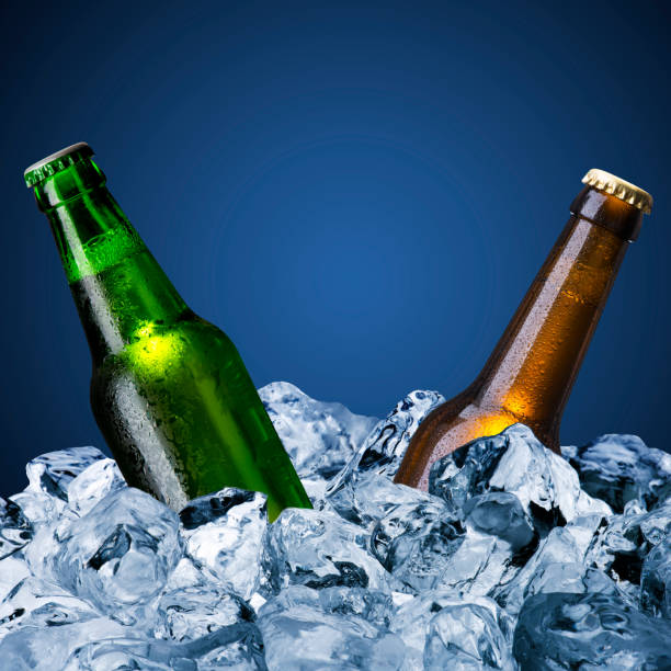 istock Two beer bottles amongst ice cubes 176612634