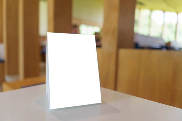 istock Mock up Menu frame standing on wood table in Bar restaurant cafe 1766135391
