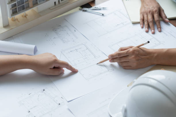 istock Architecture drawing on architectural Creative project business architecture building constructionÂ Industrial engineering Achievement Planning Design on blueprint Teamwork 1766135402