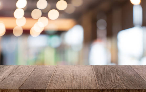 istock Mock up for space. Empty dark wooden table in front of abstract blurred bokeh background of restaurant . can be used for display or montage your product 1766135404