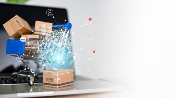 istock Shopping cart and product boxes with e-commerce network on laptop computer on white background and copy space. Represents online shopping market platform website and online payment concepts. 1766150765