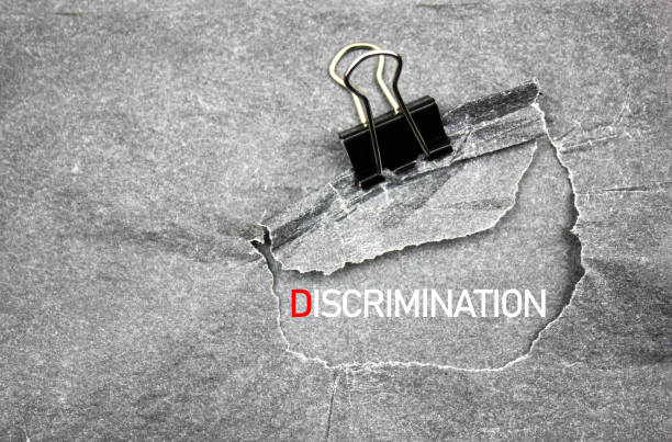 istock Discrimination, text concept. DISCRIMINATION word, inscription on black paper. 1766151322