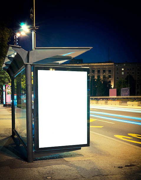 istock Lighted bus station on an empty city street at night 176615550