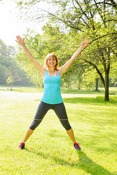 istock Smiling woman exercising outside 176616205