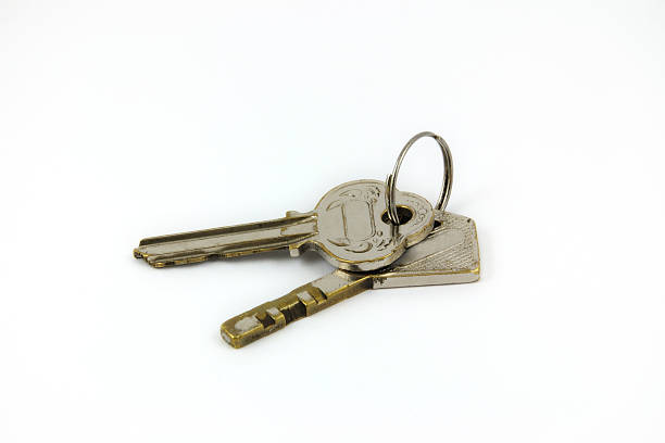istock Old brass keys isolated on white background. 176617567