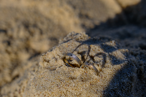 couple ring in sand