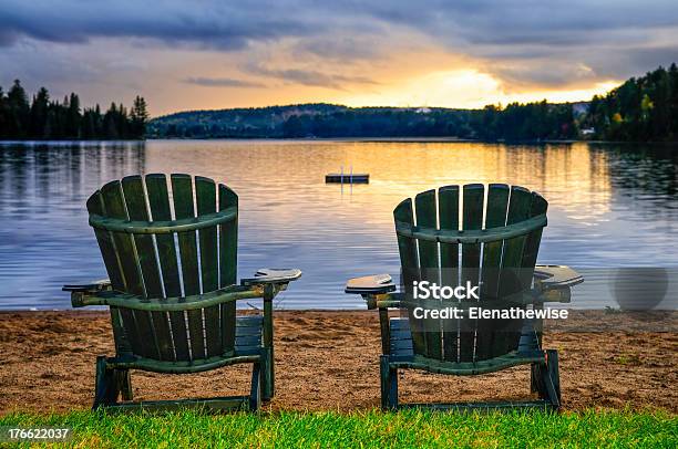 Wooden Chairs At A Sunset On The Beach Stock Photo - Download Image Now - Chair, Adirondack Chair, Lake