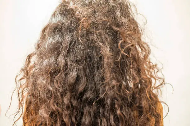 woman with long curly hair