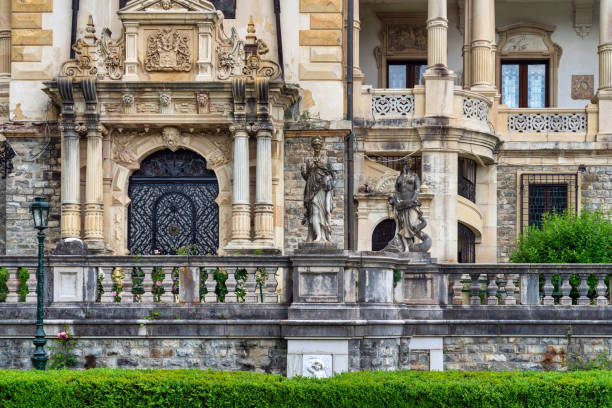 October 30, 2023: Sinaia, Romania - Peles Castle. Peles Castle is a castle in Romania located in Sinaia. This photo shows the castle from the exterior and was taken during a rainy day.