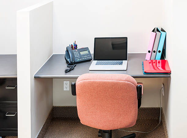 istock Office cubicle with laptop, chair and files 176623354