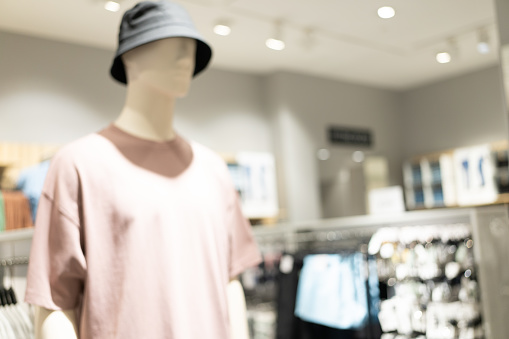 Abstract blurred background of interior clothing store at Shopping Mall. blurred image background with clothing store.