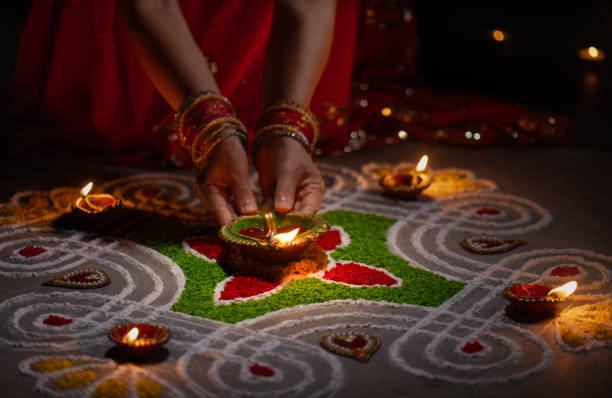Clay diya lamps lit during diwali celebration, Diwali, or Deepavali, is India's biggest and most important holiday. stock photo