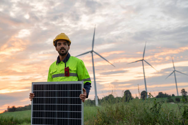 istock Technician installing solar cells in wind farm. Service engineers checking system of windmill. Wind turbines generate electricity. Clean and Renewable energy concept. 1766259298