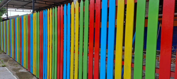 istock Multi colored rainbow wooden fence in garden background 1766266106