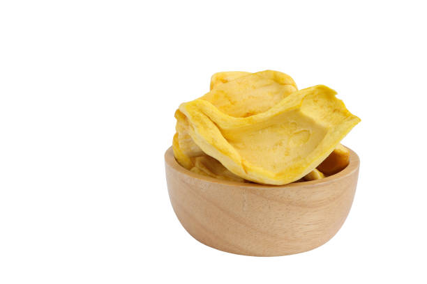 Dried jackfruit chips, dried jackfruit fruit in wooden bowl isolated on white background with clipping paths.