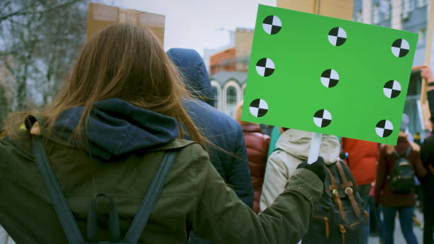 istock Woman holding sign at demonstration 1766284796