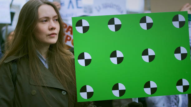 young adult female activist during demonstration - protestor protest sign strike imagens e fotografias de stock